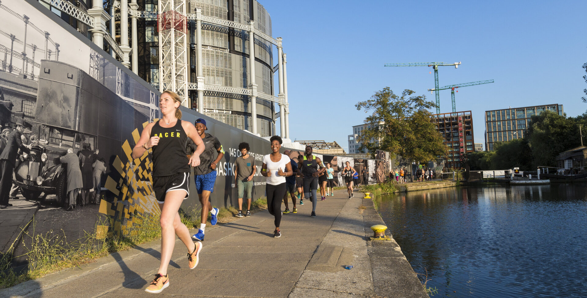 runners on the canal tow path, past Gasholders at King's Cross